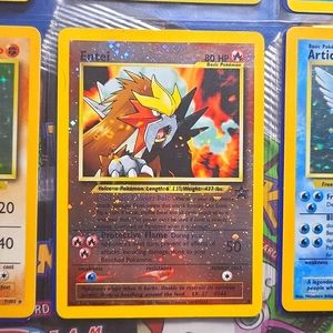 Holographic 2001 Entei, like new, sealed in ultra pro card sleeve, no scratches